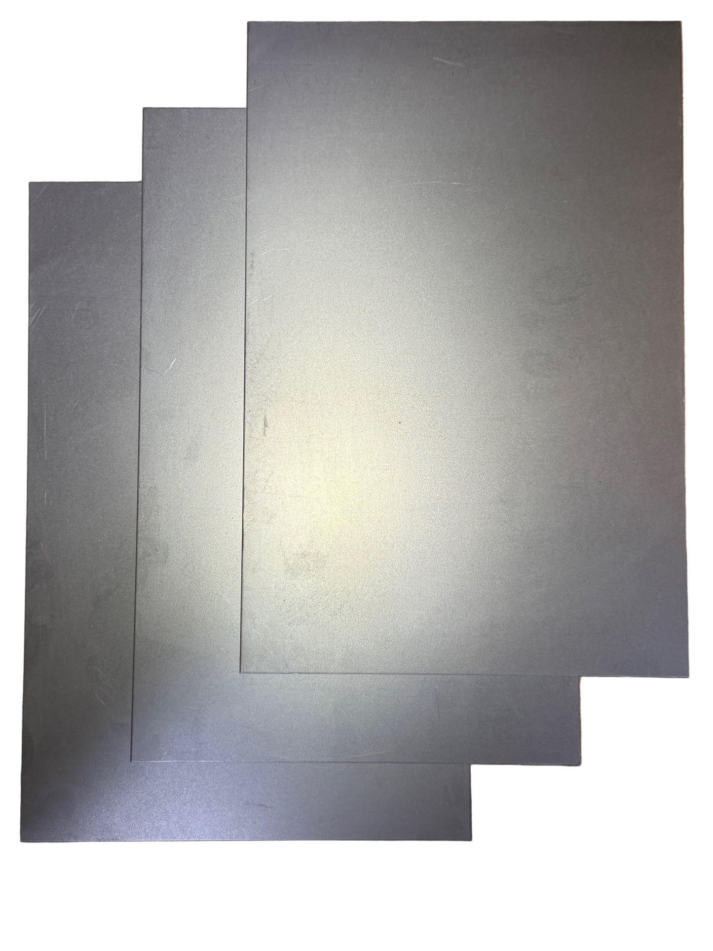 8x12 Inch Pre-Cut Cold Rolled Sheet Metal – 18 Gauge three sheets on white background in diagonal pattern