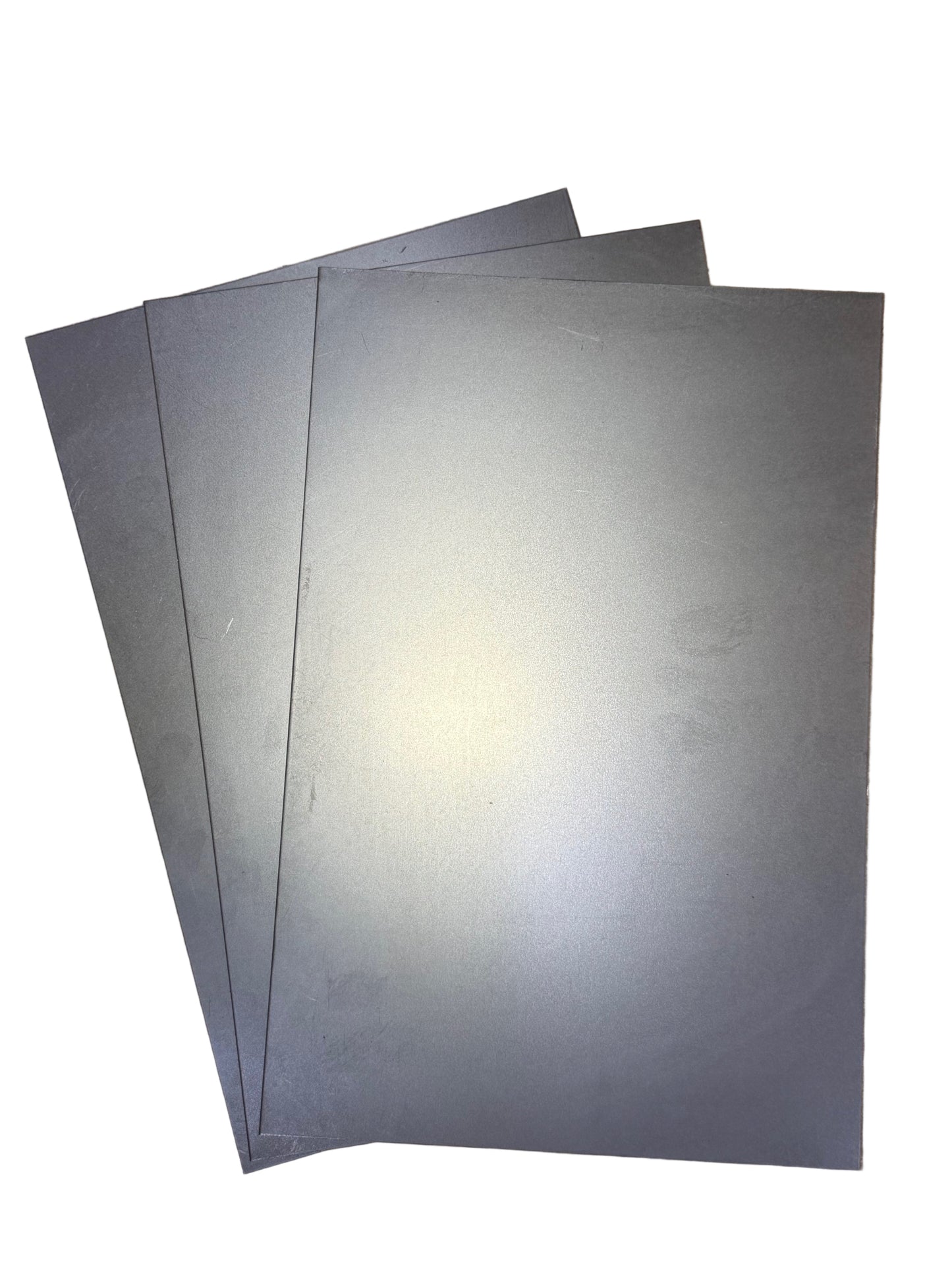 8x12 Inch Pre-Cut Cold Rolled Sheet Metal – 18 Gauge three sheets on white background in fan pattern